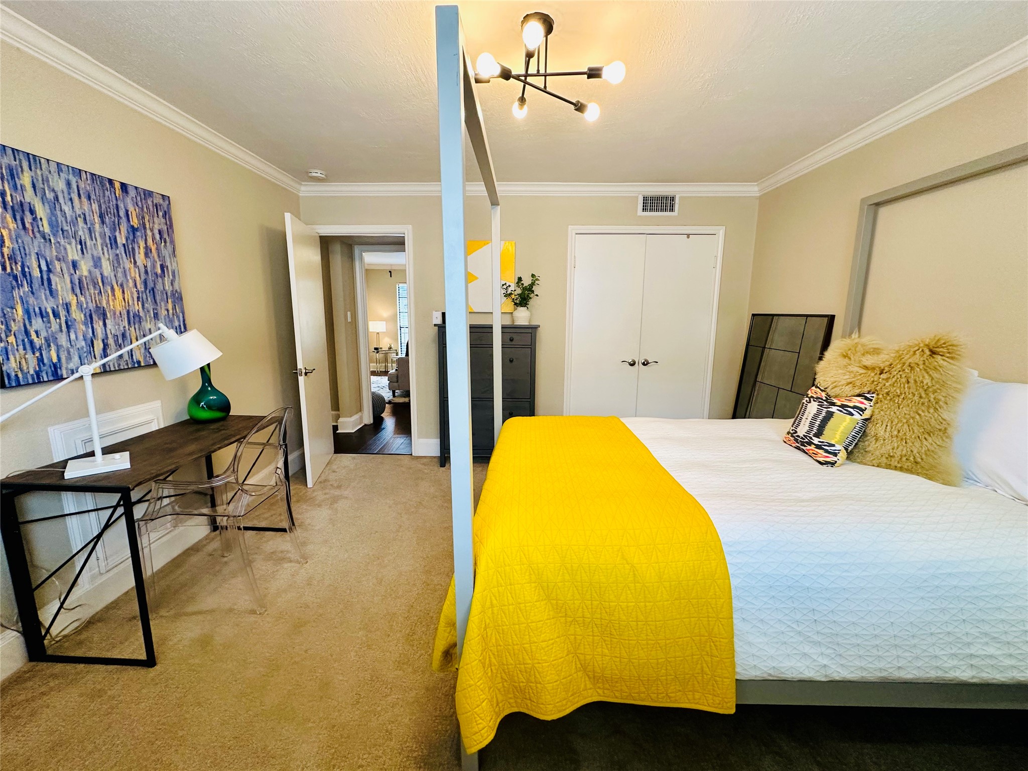 3402 Garrott Street, Unit 16 Houston, TX 77006 - Photo 19 of 47 a bedroom with a bed and wooden floor