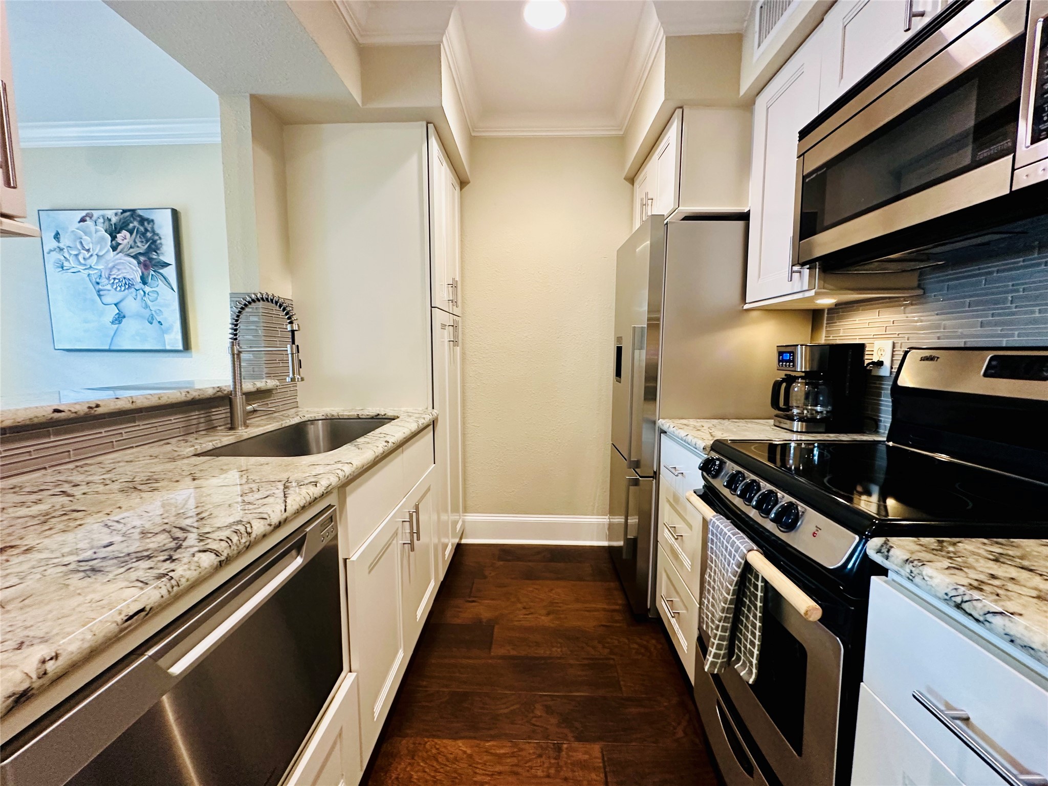 3402 Garrott Street, Unit 16 Houston, TX 77006 - Photo 2 of 47 a kitchen with stainless steel appliances granite countertop a stove and a sink