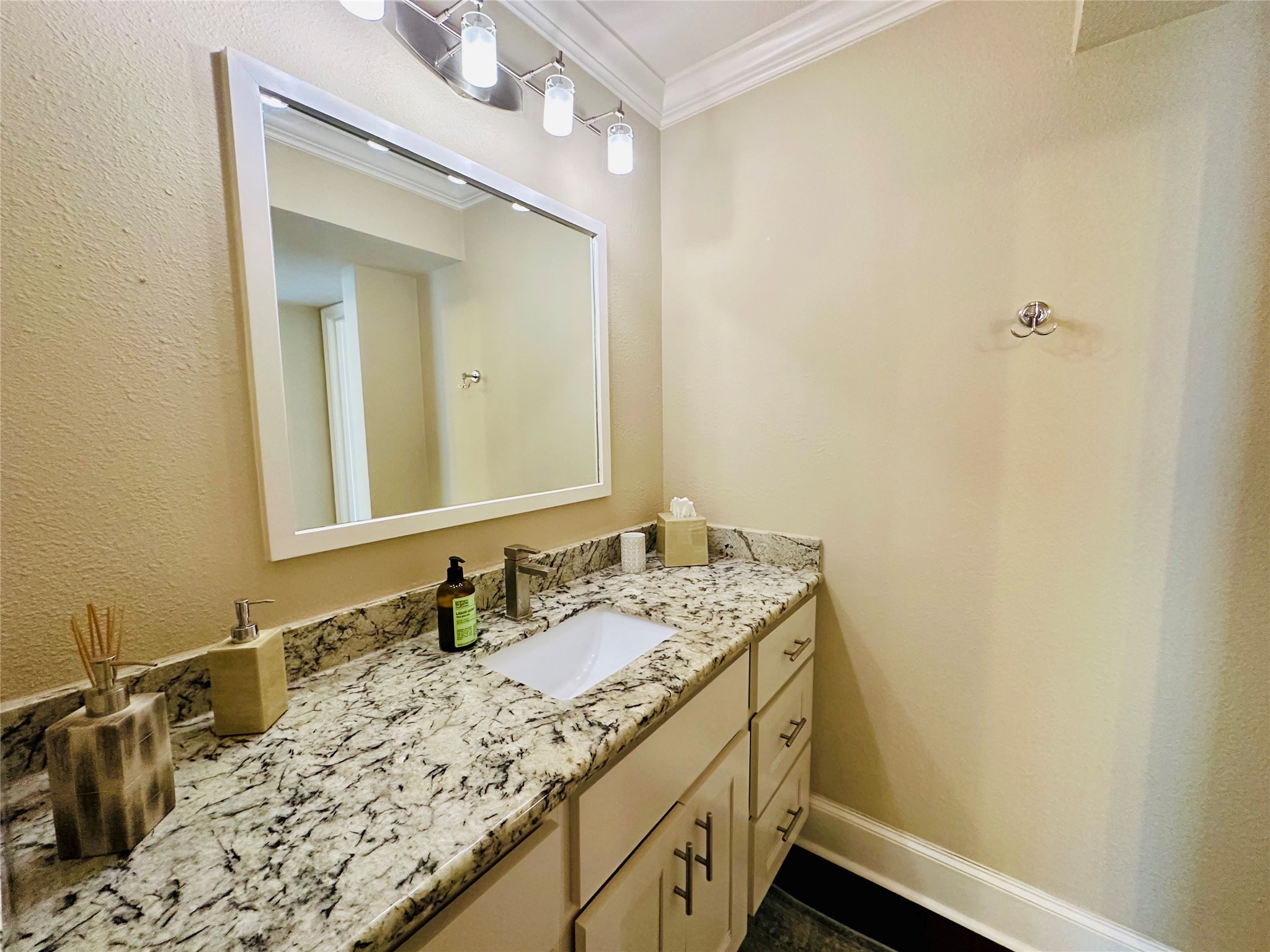 3402 Garrott Street, Unit 16 Houston, TX 77006 - Photo 23 of 47 a bathroom with a sink and a mirror