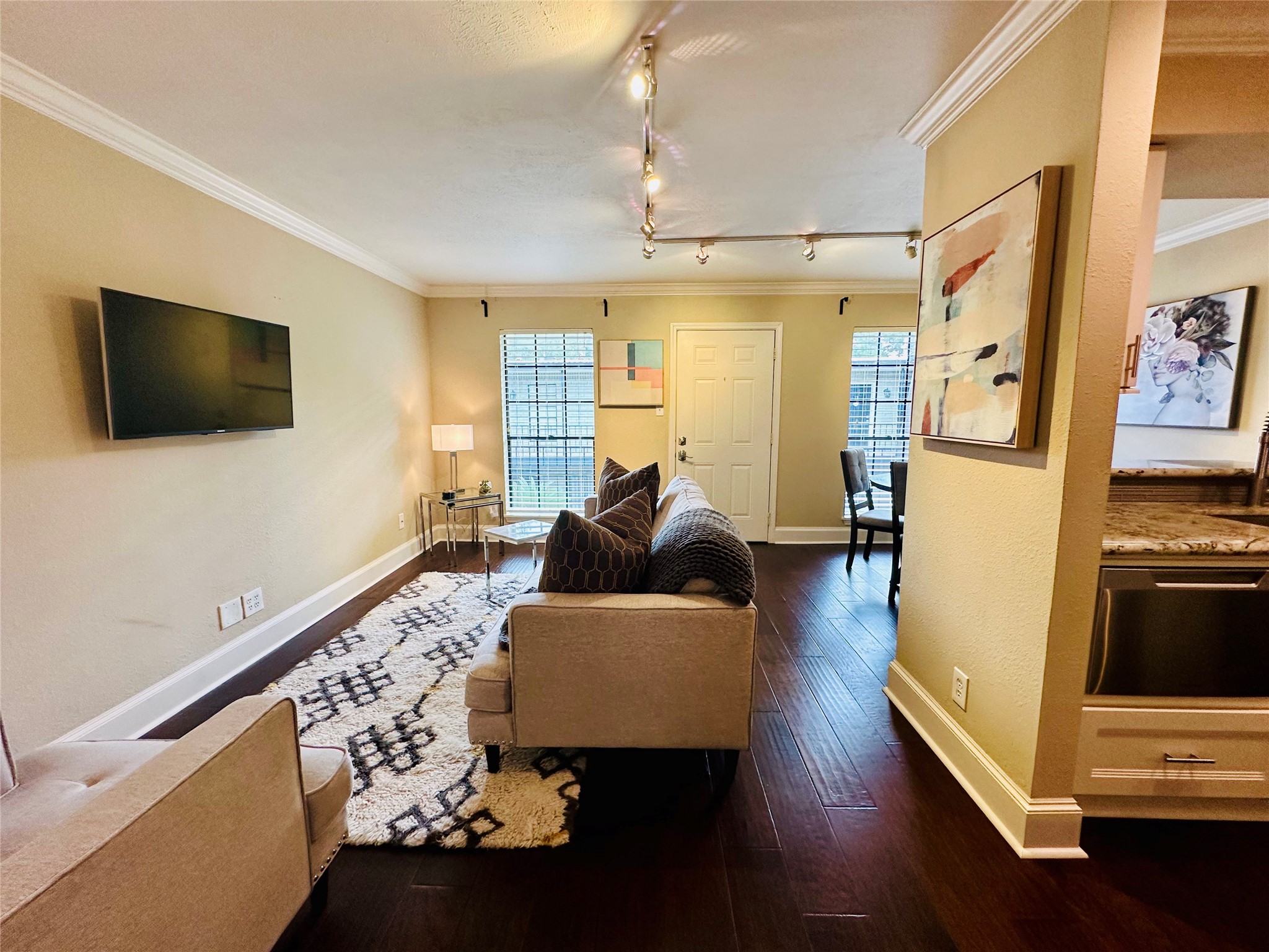 3402 Garrott Street, Unit 16 Houston, TX 77006 - Photo 25 of 47 a living room with furniture and a flat screen tv