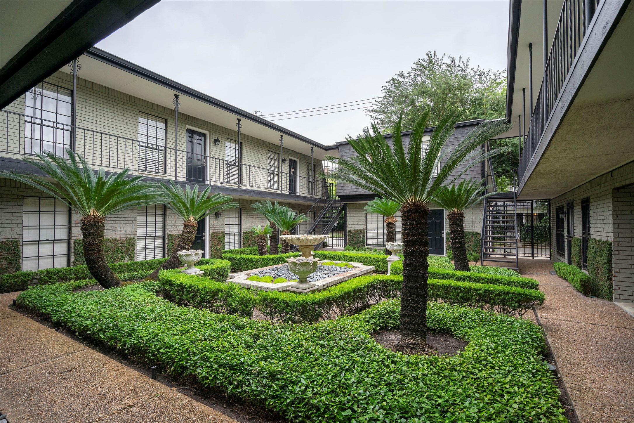3402 Garrott Street, Unit 16 Houston, TX 77006 - Photo 31 of 47 a front view of a house with garden