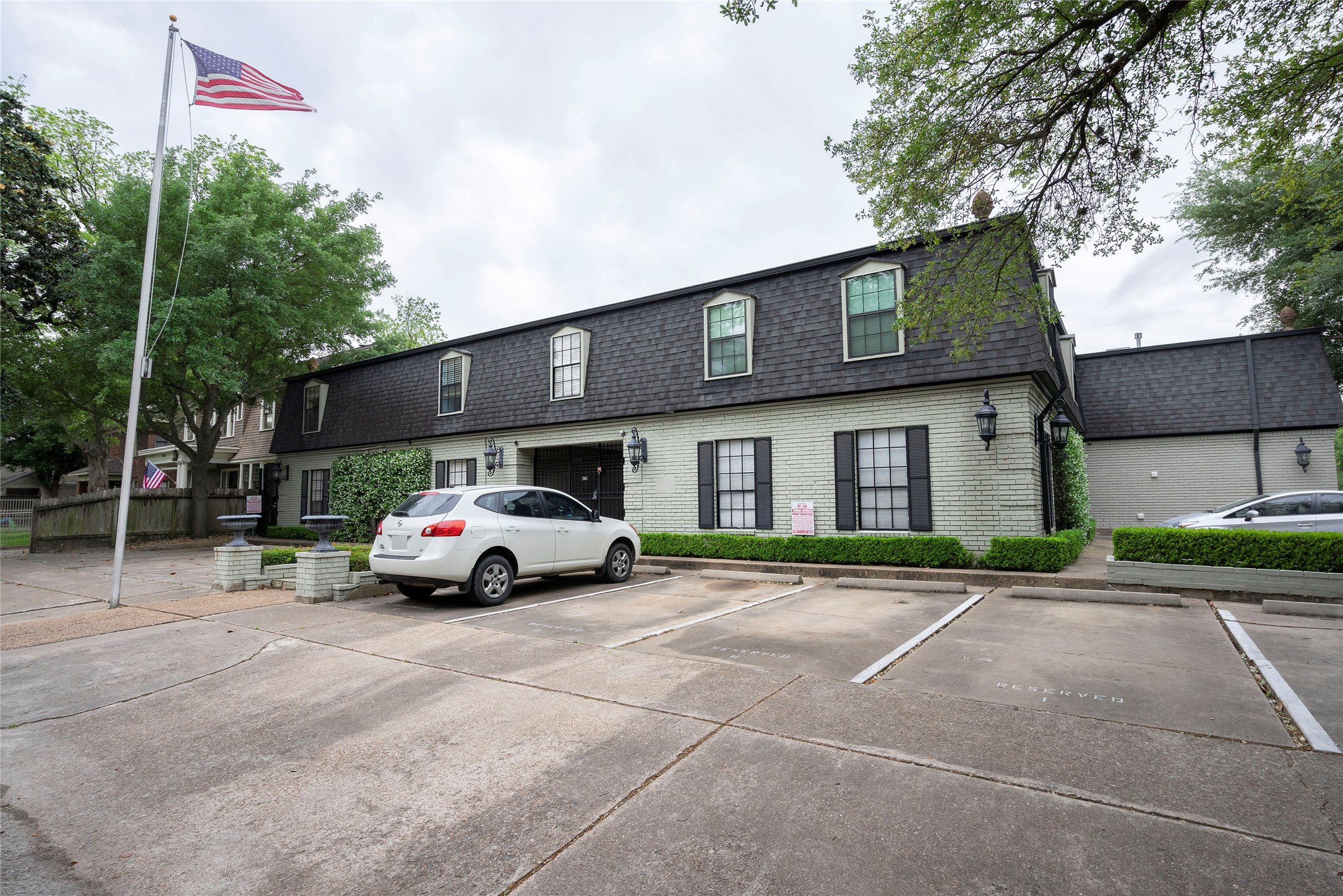 3402 Garrott Street, Unit 16 Houston, TX 77006 - Photo 32 of 47 a car parked in front of a house
