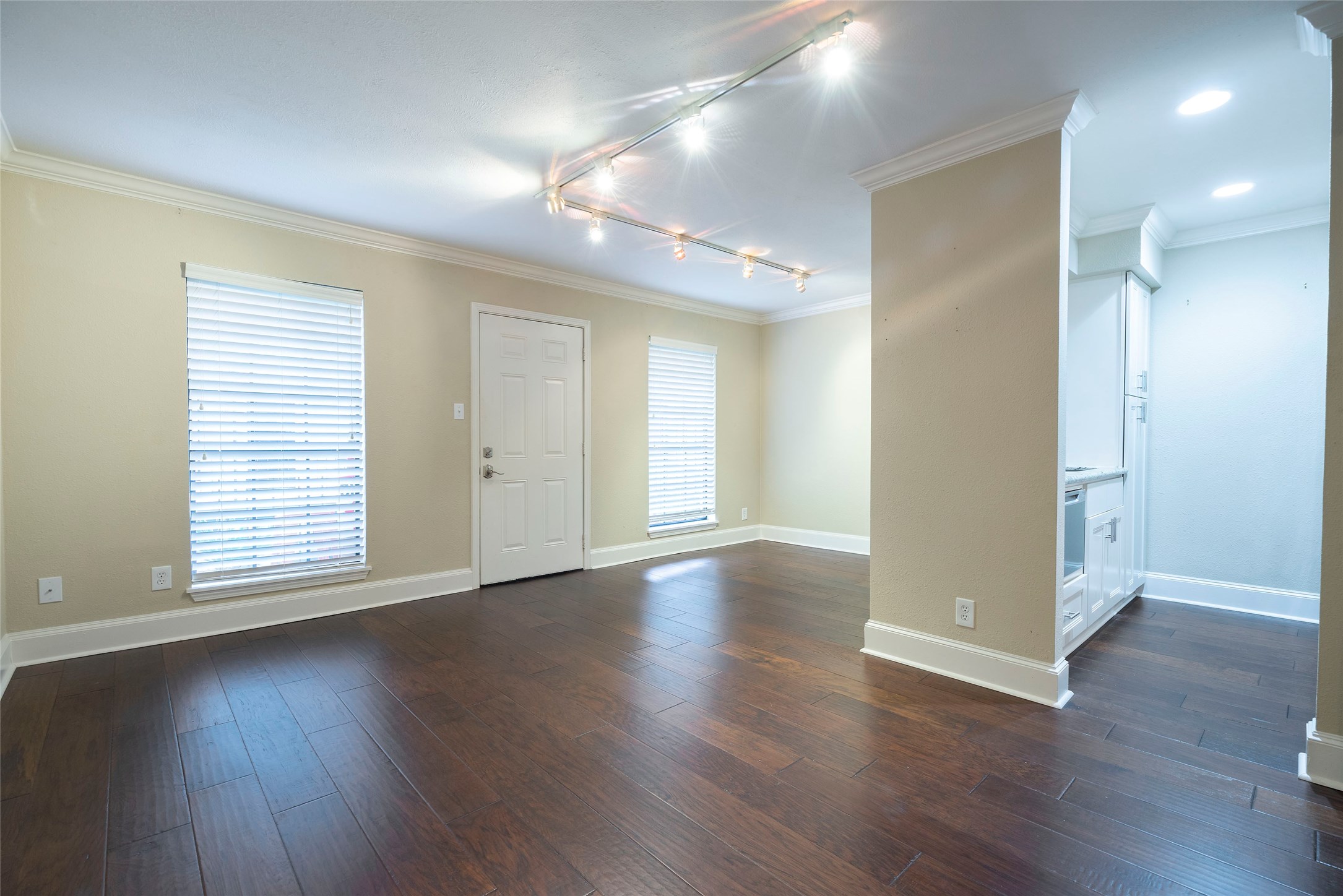 3402 Garrott Street, Unit 16 Houston, TX 77006 - Photo 34 of 47 a view of an empty room with wooden floor and a window