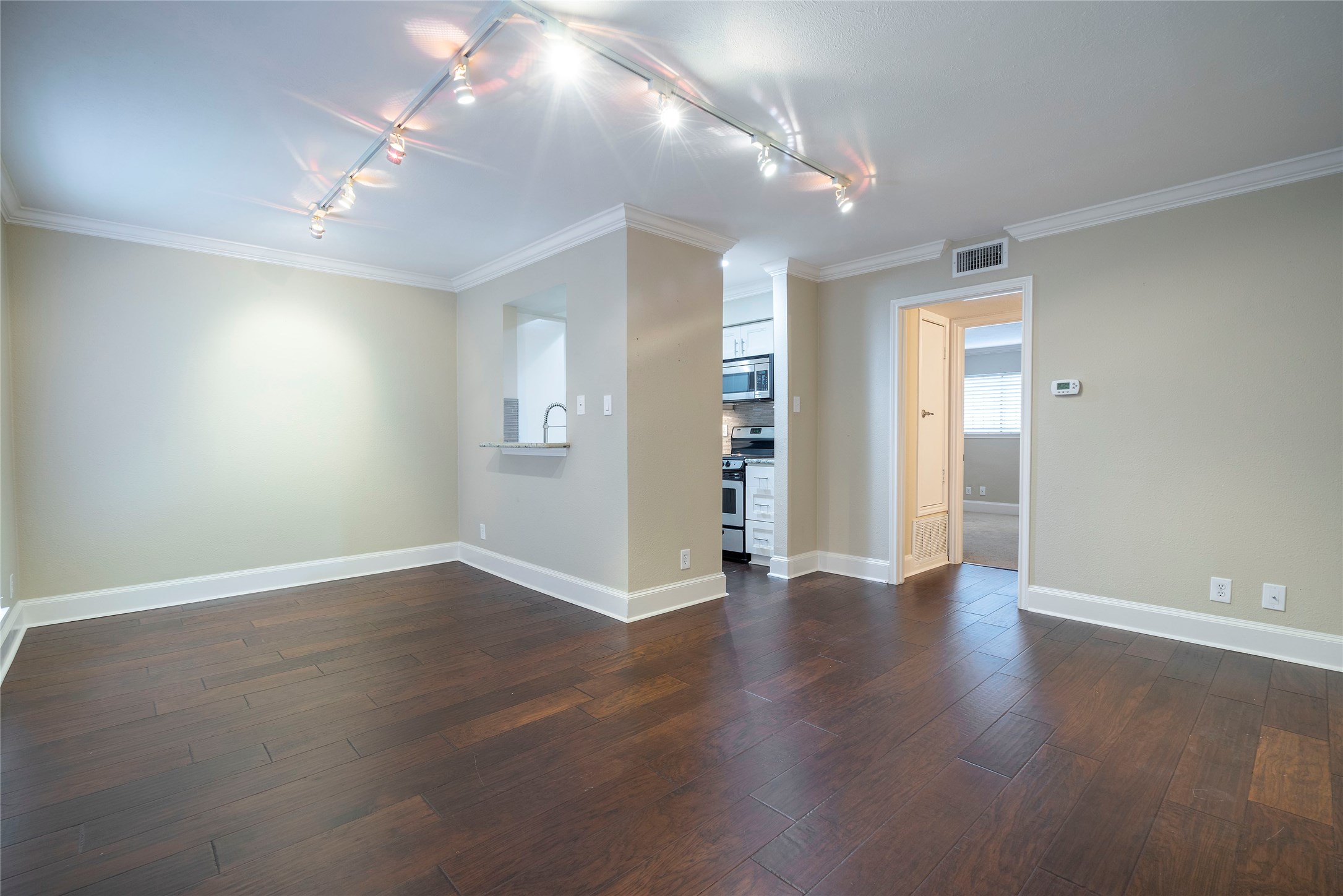 3402 Garrott Street, Unit 16 Houston, TX 77006 - Photo 35 of 47 a view of an empty room with wooden floor