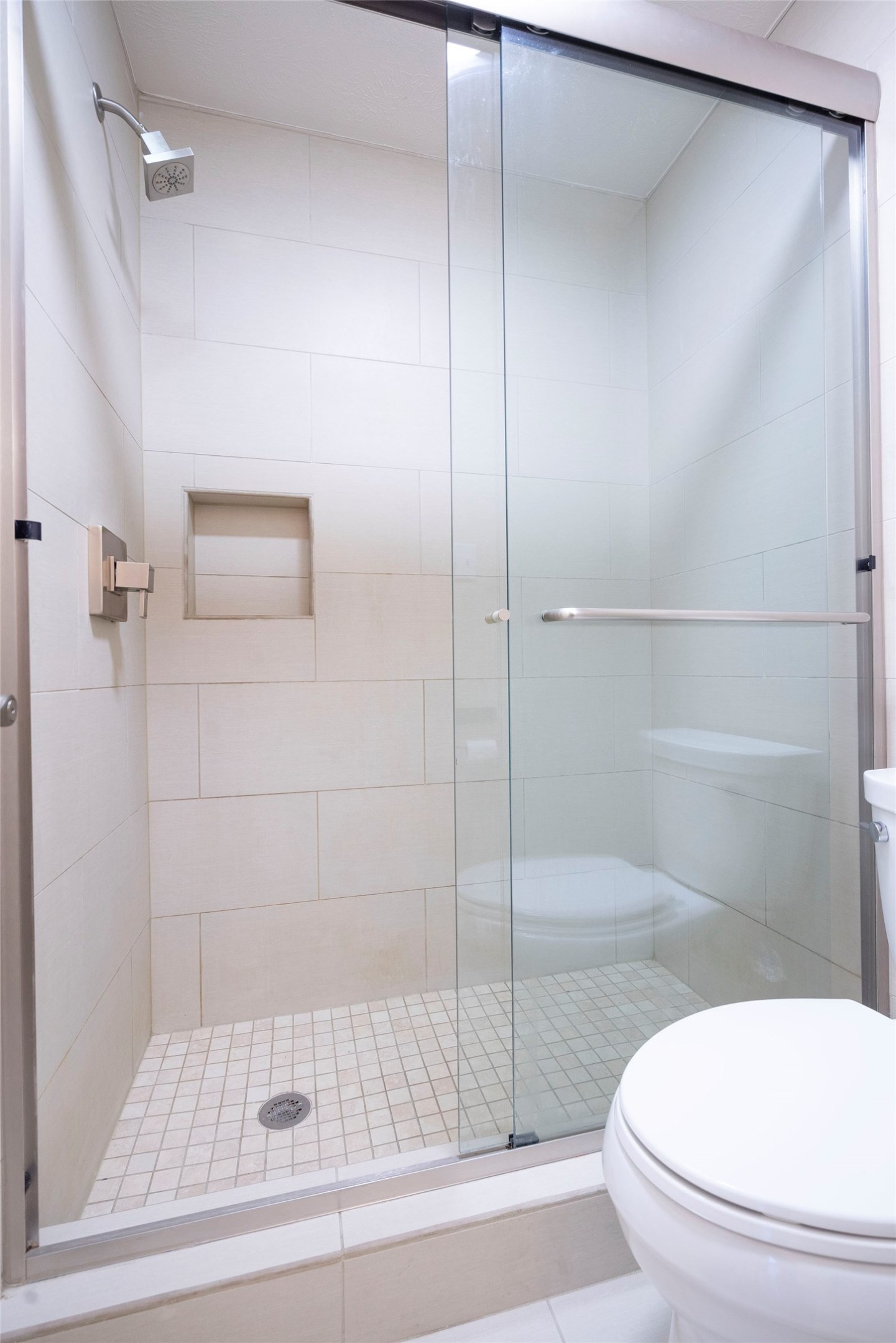 3402 Garrott Street, Unit 16 Houston, TX 77006 - Photo 41 of 47 a bathroom with a shower and toilet