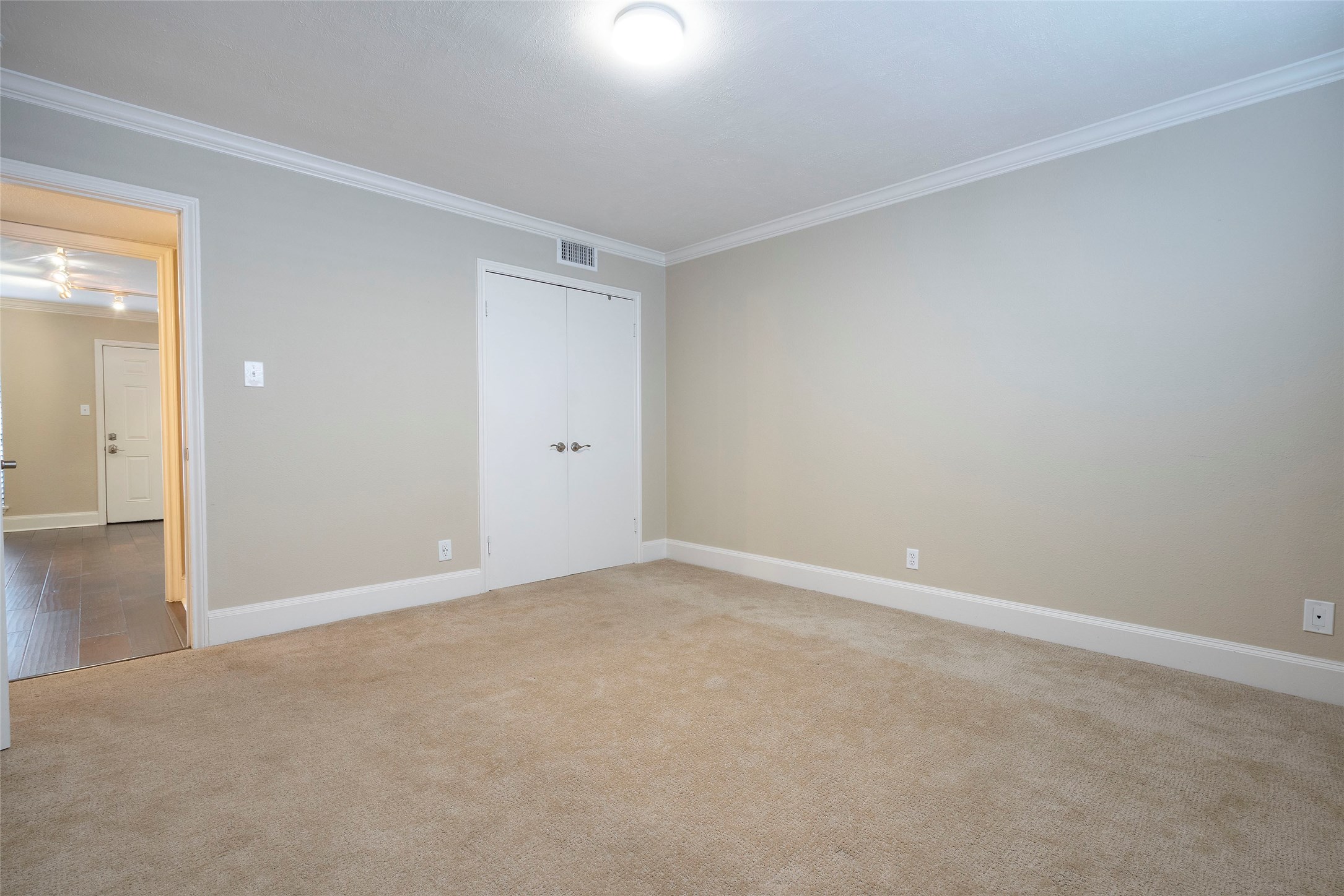 3402 Garrott Street, Unit 16 Houston, TX 77006 - Photo 43 of 47 a view of an empty room and wooden floor