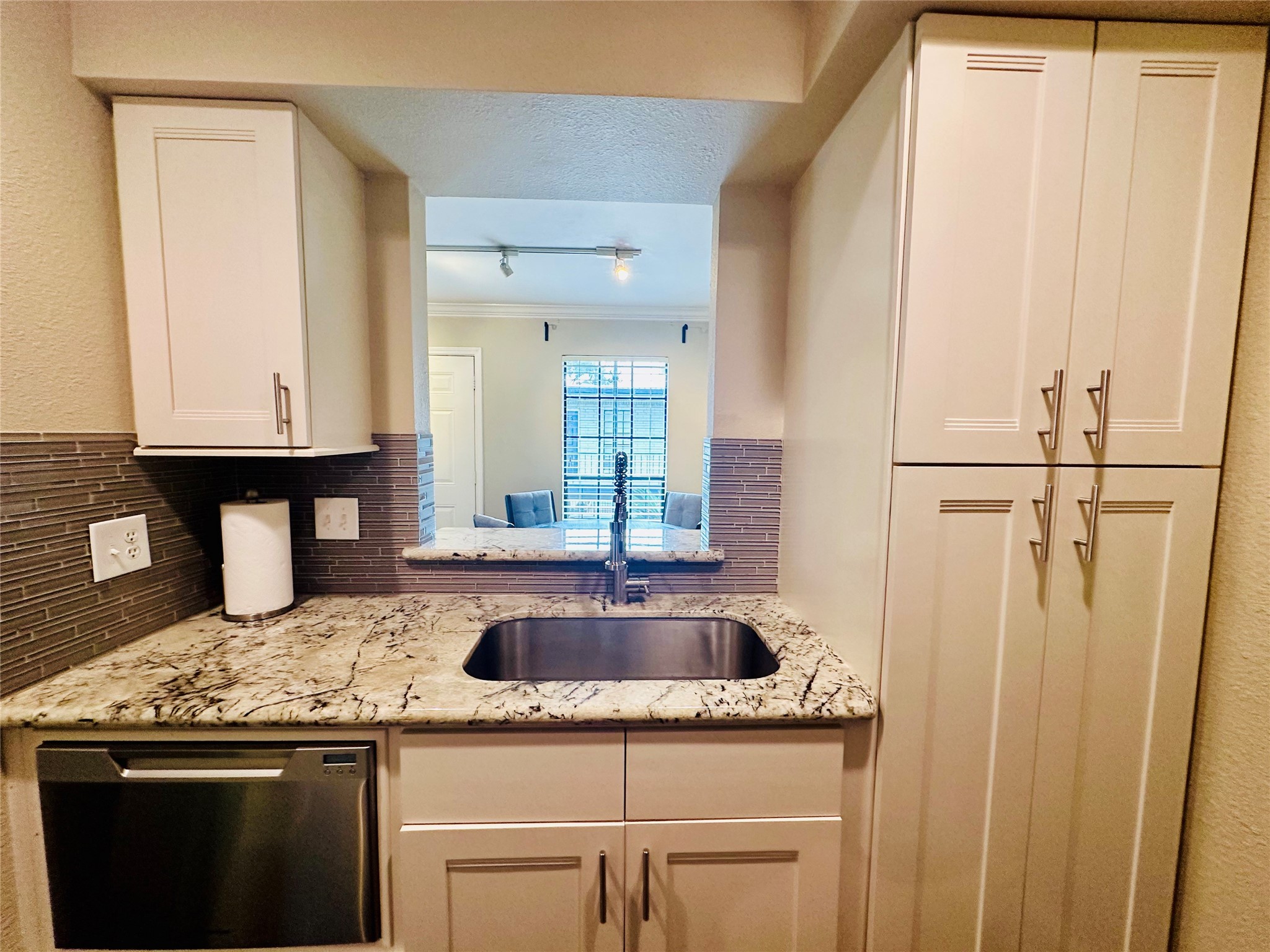 3402 Garrott Street, Unit 16 Houston, TX 77006 - Photo 5 of 47 a kitchen with a sink and cabinets