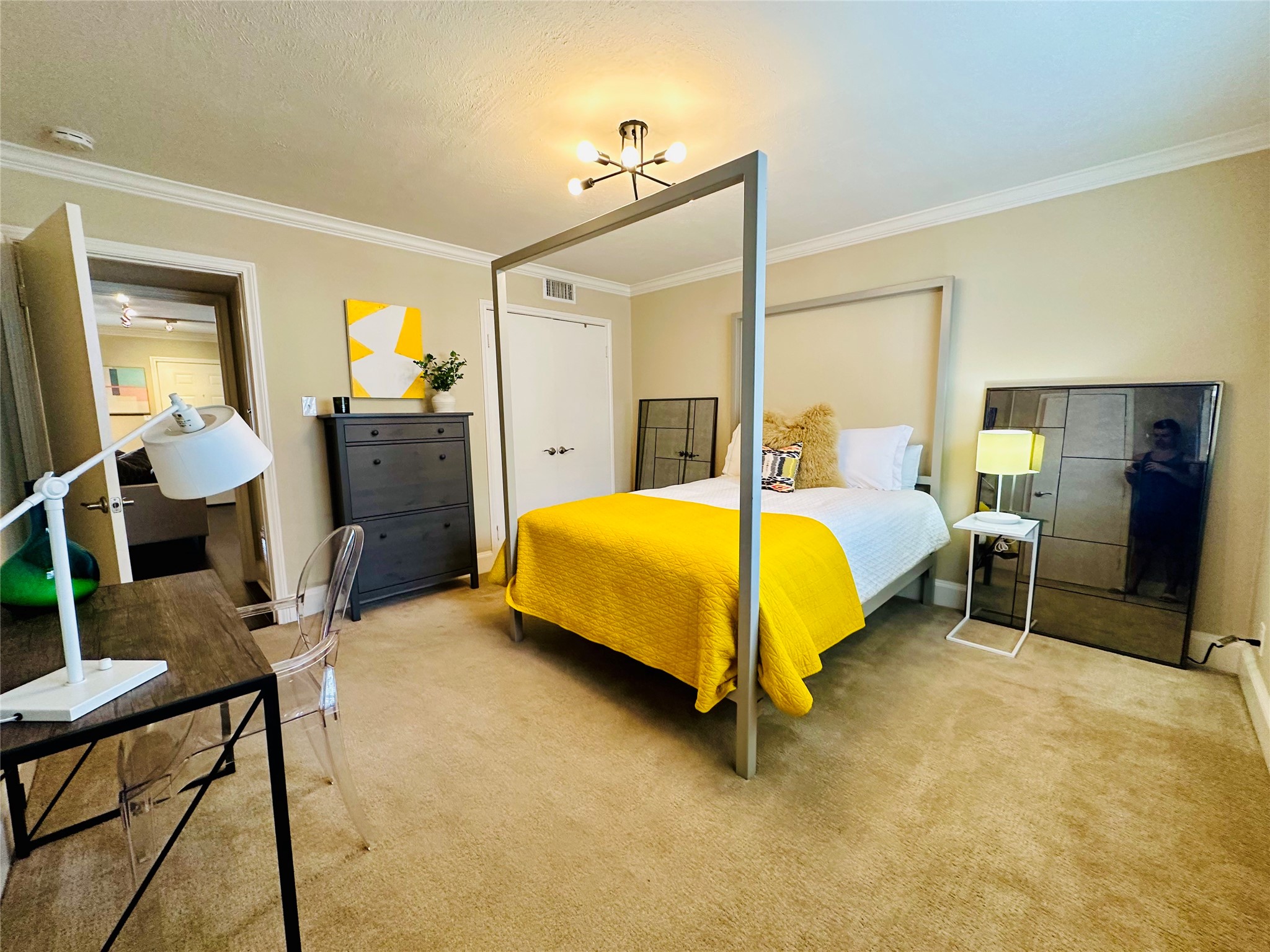 3402 Garrott Street, Unit 16 Houston, TX 77006 - Photo 7 of 47 a bedroom with a bed and furniture