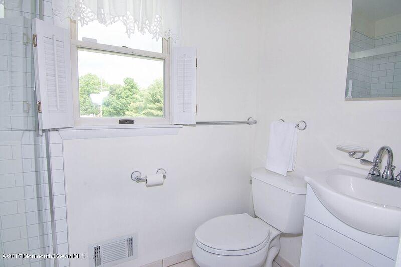 800 Waterworks Road Freehold, NJ 07728 - Photo 14 of 28 a white toilet sitting next to a bathroom sink