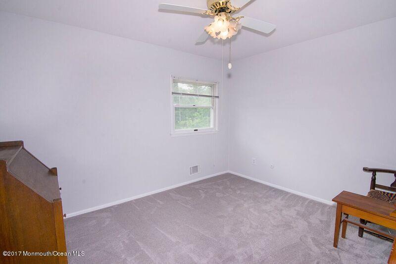 800 Waterworks Road Freehold, NJ 07728 - Photo 17 of 28 wooden floor in an empty room with a window