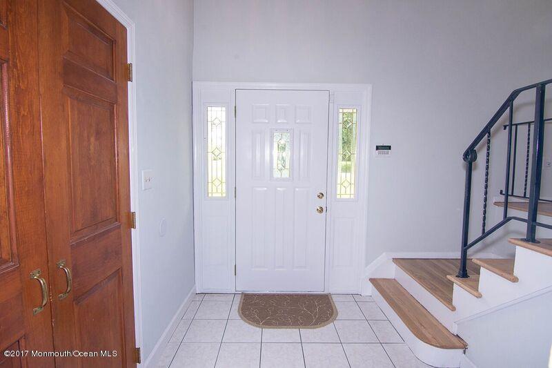800 Waterworks Road Freehold, NJ 07728 - Photo 2 of 28 a view of front door with lounge chair