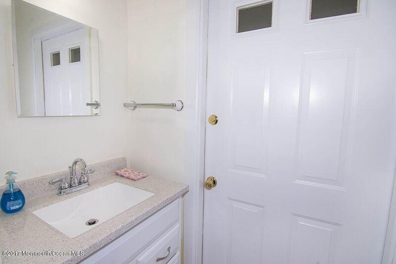 800 Waterworks Road Freehold, NJ 07728 - Photo 22 of 28 a bathroom with a sink and a mirror