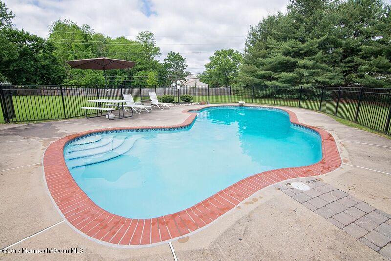 800 Waterworks Road Freehold, NJ 07728 - Photo 24 of 28 a view of a swimming pool with a patio