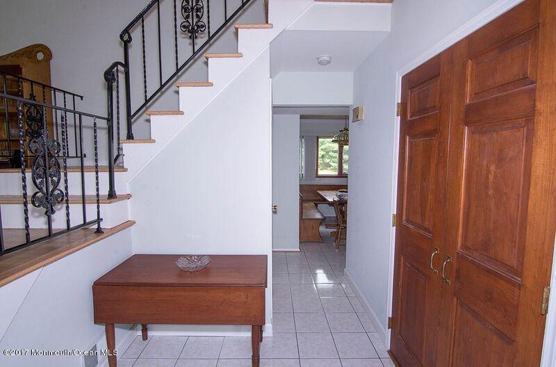 800 Waterworks Road Freehold, NJ 07728 - Photo 3 of 28 a view of hallway with livingroom and stairs