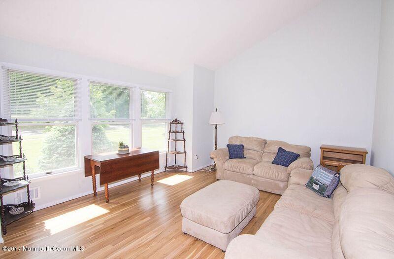 800 Waterworks Road Freehold, NJ 07728 - Photo 5 of 28 a living room with furniture and a large window