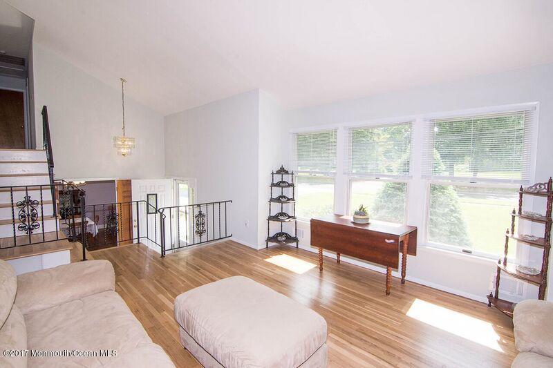 800 Waterworks Road Freehold, NJ 07728 - Photo 6 of 28 a living room with furniture and a large window