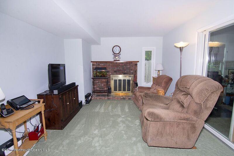 800 Waterworks Road Freehold, NJ 07728 - Photo 7 of 28 a living room with furniture and a fireplace