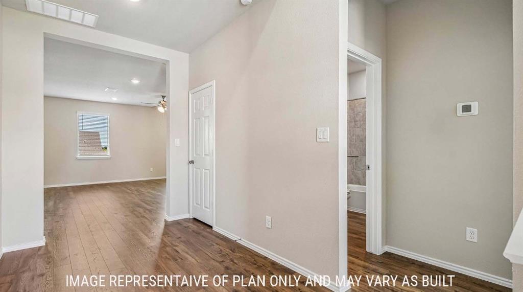 10101 Altair Drive Waco, TX 76708 - Photo 17 of 36 Wood-finish flooring throughout, light-toned wall paint, recessed lighting, and a paneled interior door
