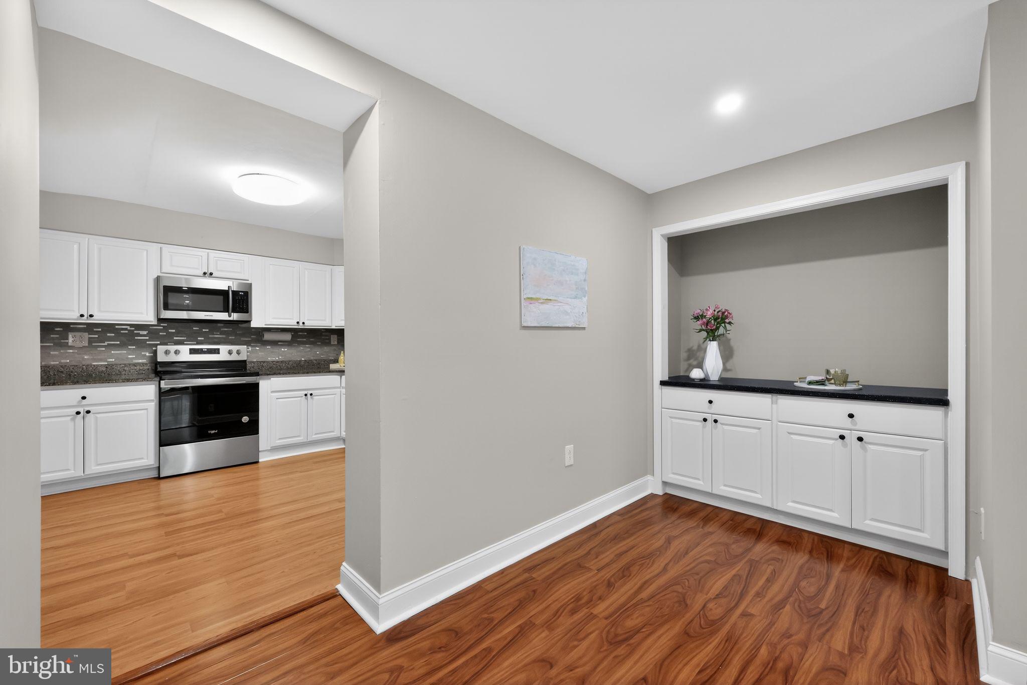400 Glendale Road, Unit F35 Havertown, PA 19083 - Photo 14 of 36 a kitchen with wooden floors and appliances