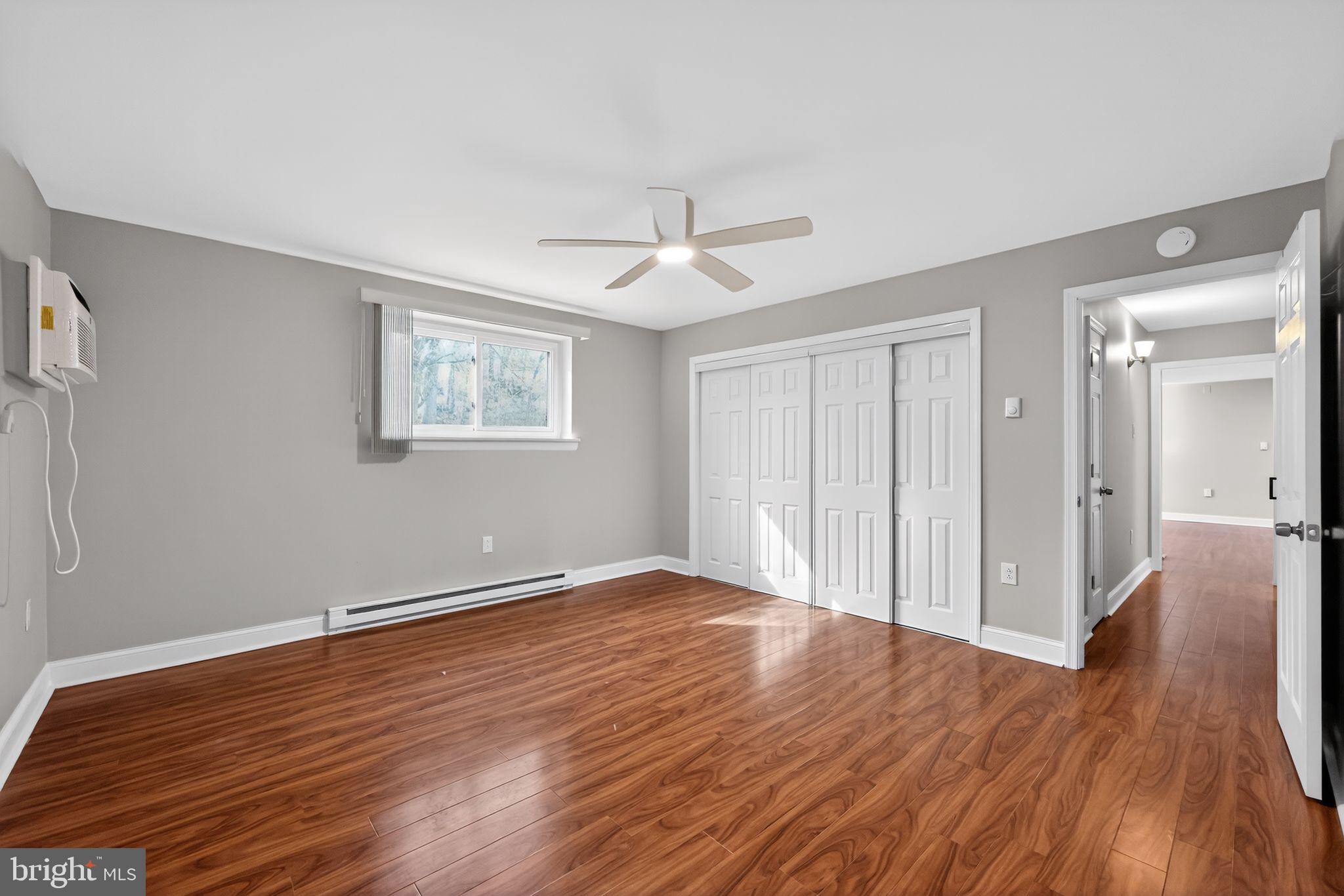 400 Glendale Road, Unit F35 Havertown, PA 19083 - Photo 23 of 36 a view of an empty room with wooden floor and a window