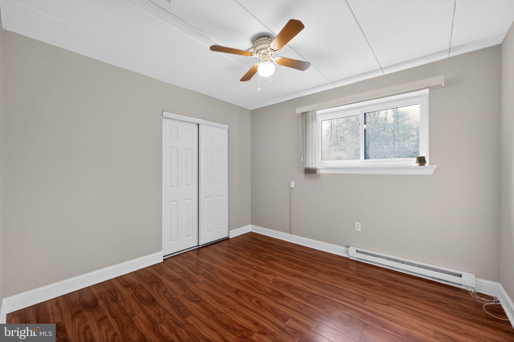 400 Glendale Road, Unit F35 Havertown, PA 19083 - Photo 26 of 36 wooden floor in an empty room with a window