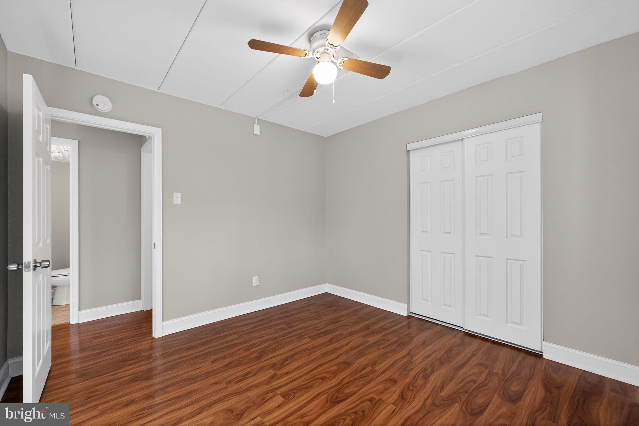 400 Glendale Road, Unit F35 Havertown, PA 19083 - Photo 27 of 36 an empty room with wooden floor and ceiling fan