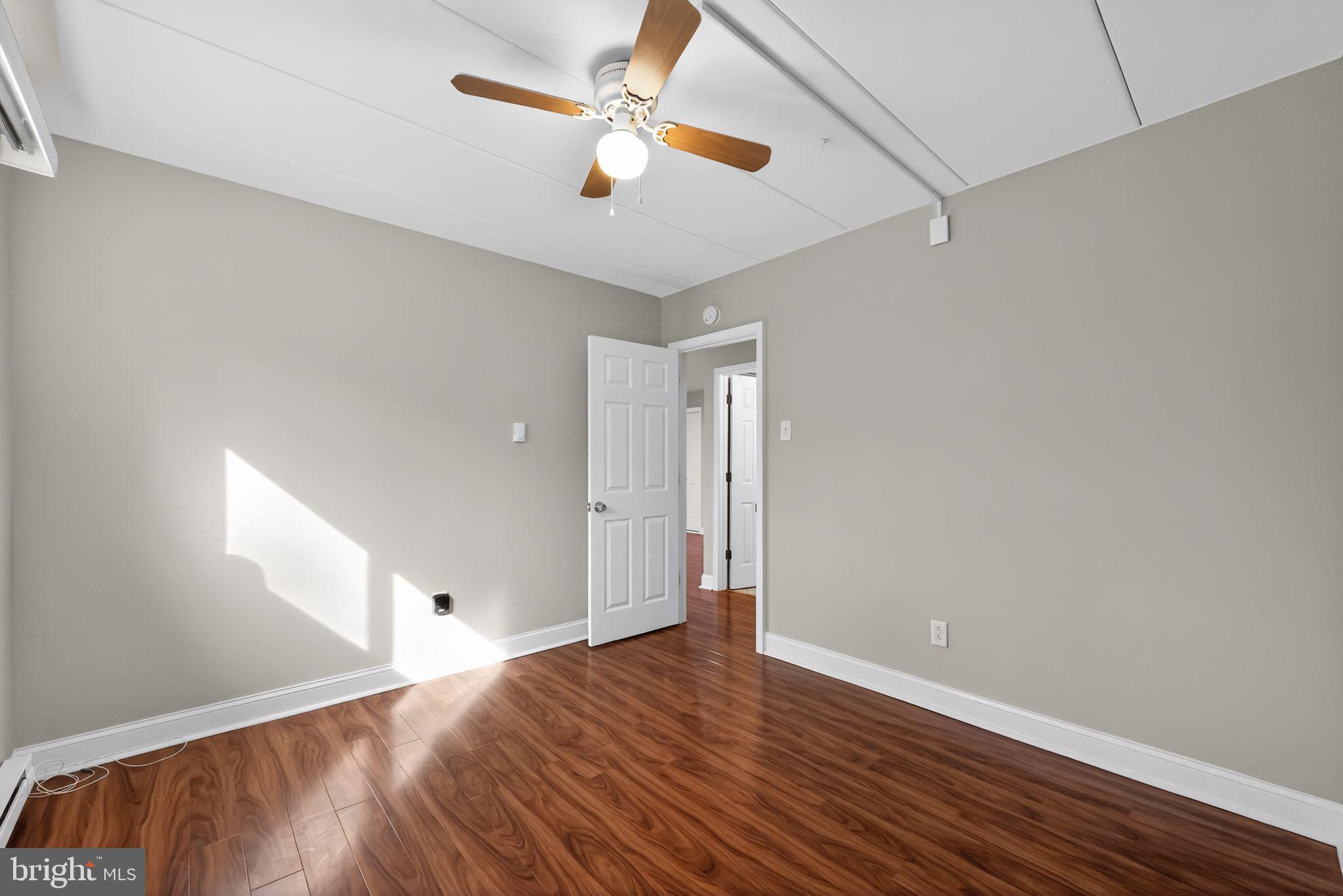 400 Glendale Road, Unit F35 Havertown, PA 19083 - Photo 28 of 36 a view of an empty room with wooden floor