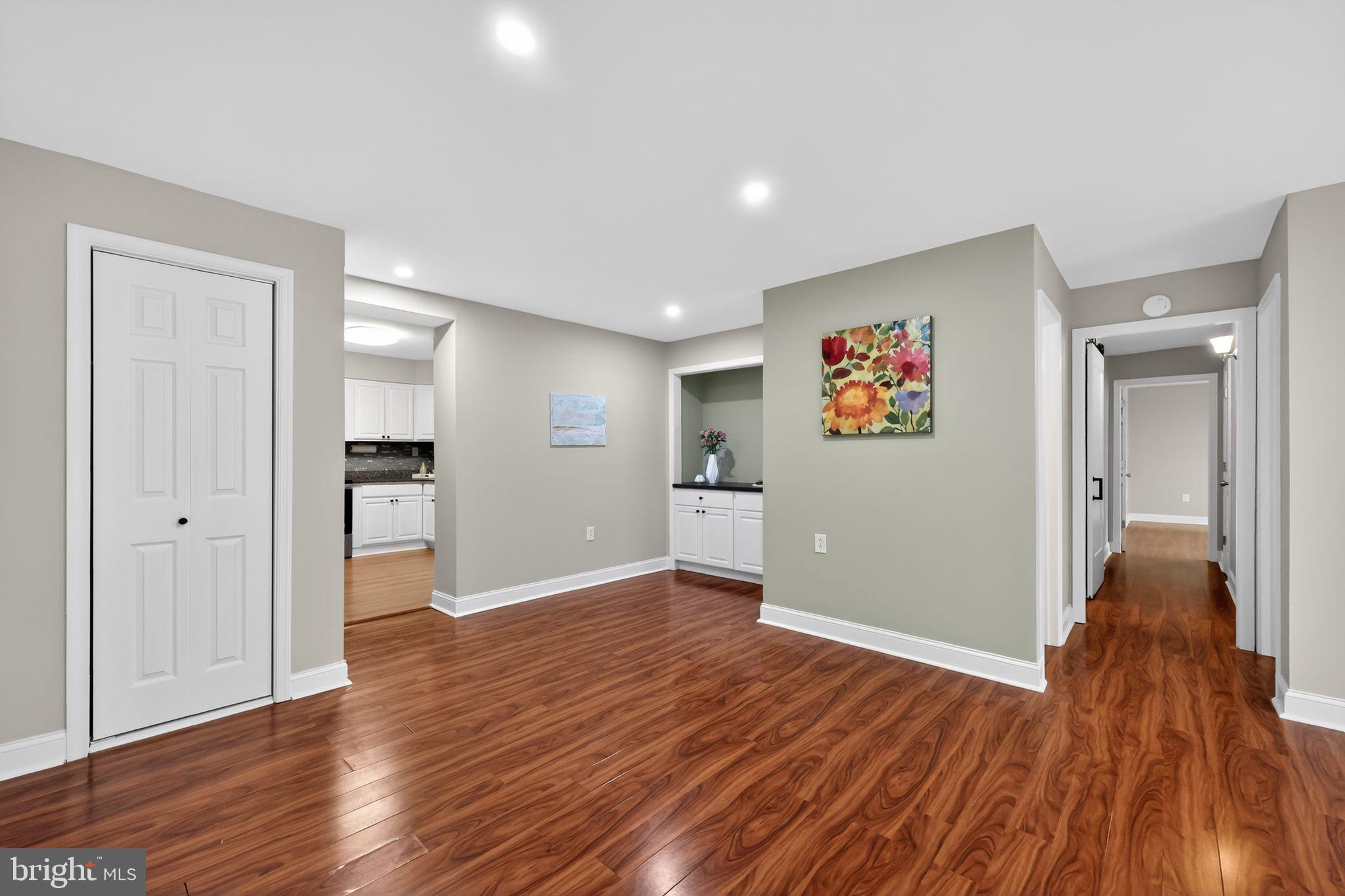 400 Glendale Road, Unit F35 Havertown, PA 19083 - Photo 7 of 36 a view of a big room with wooden floor and a bedroom