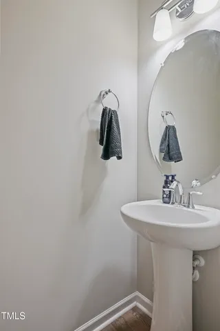 a bathroom with a sink and mirror