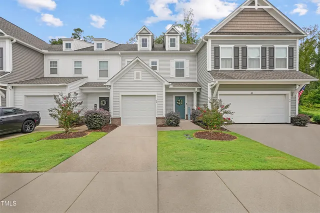 a view of an empty room with staircase