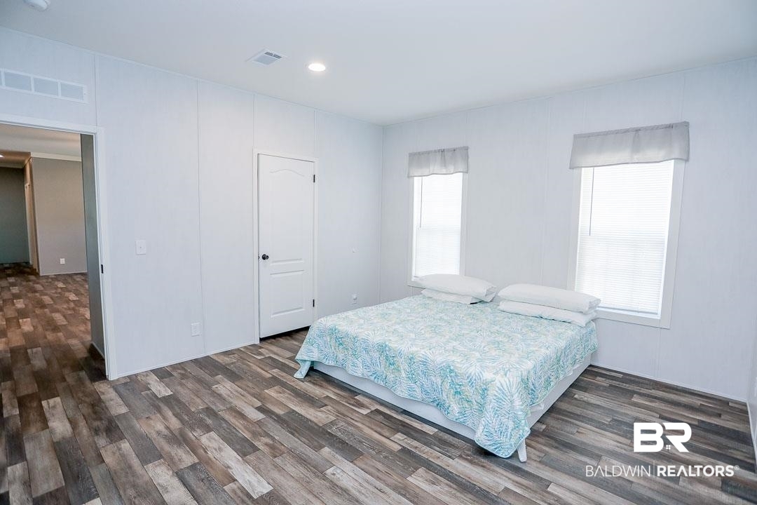 19180 Horseshoe Circle Seminole, AL 36574 - Photo 26 of 38 Bedroom featuring recessed lighting and dark wood-style floors