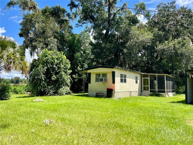 a view of a playground with basketball court