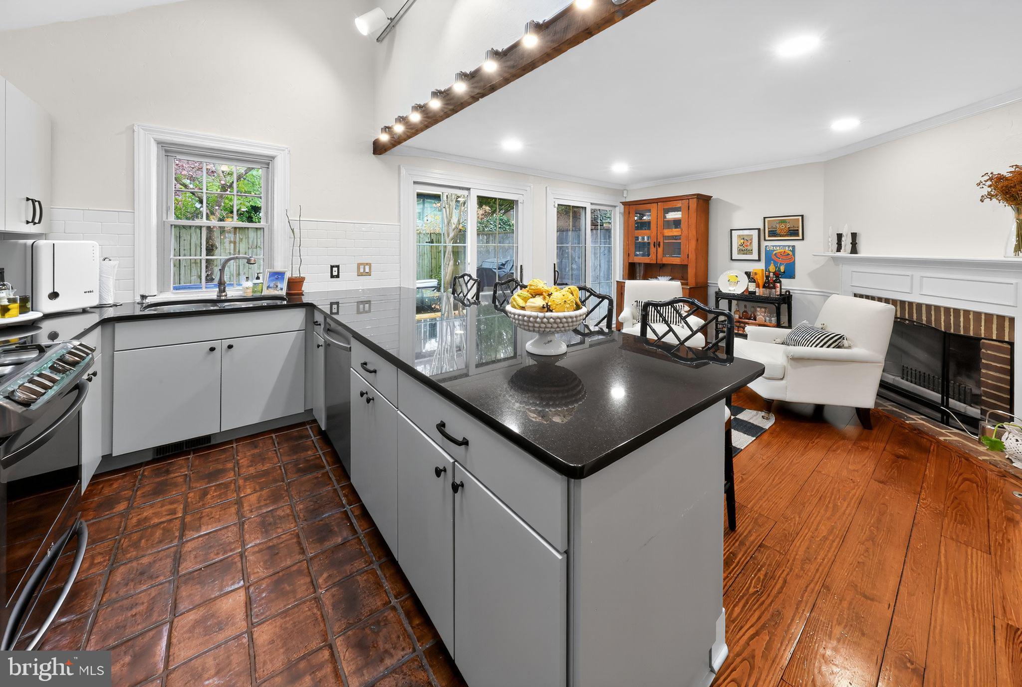 10 Rockford Road Wilmington, DE 19806 - Photo 15 of 30 a kitchen with sink cabinets and living room view