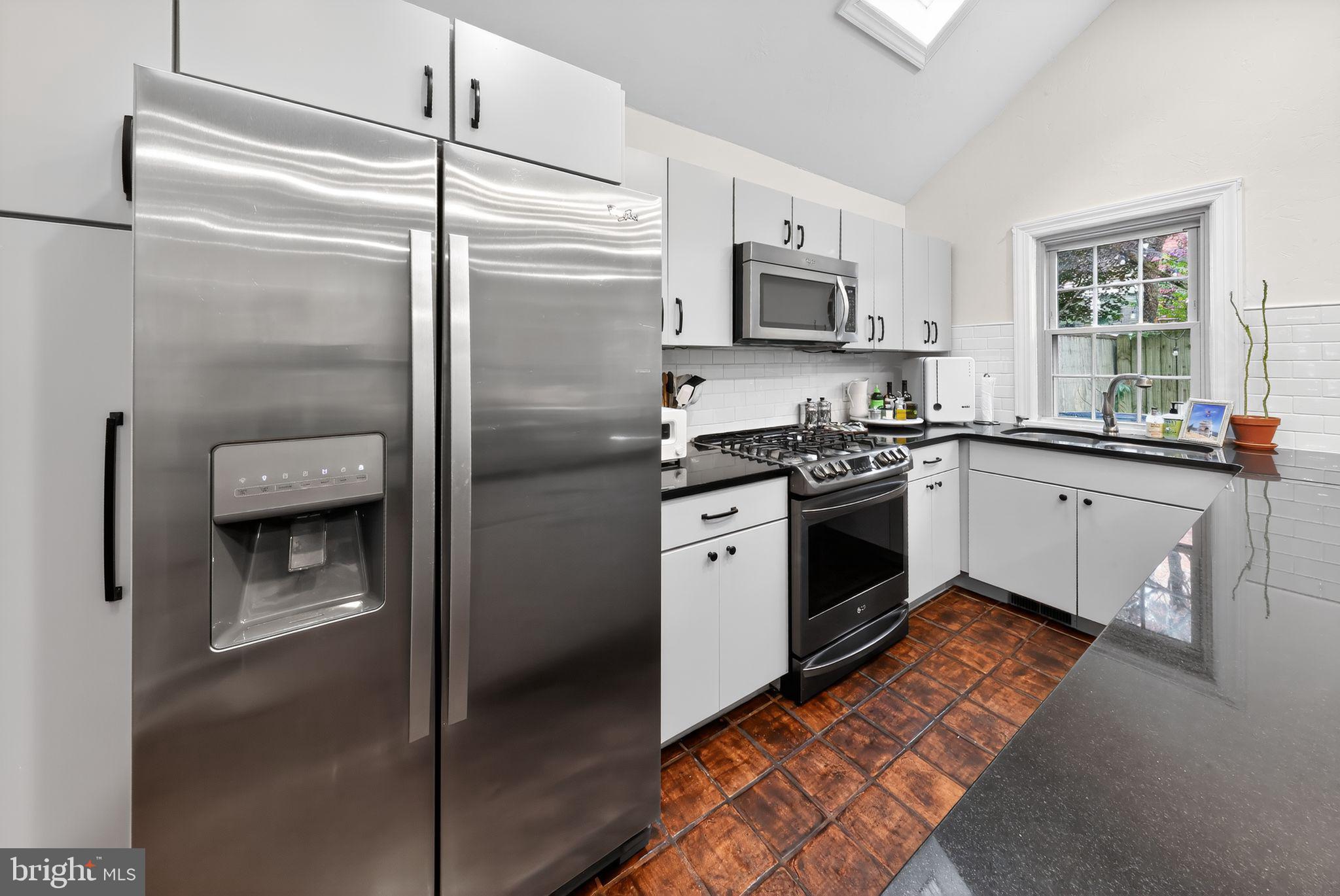 10 Rockford Road Wilmington, DE 19806 - Photo 16 of 30 a kitchen with a stove sink and refrigerator