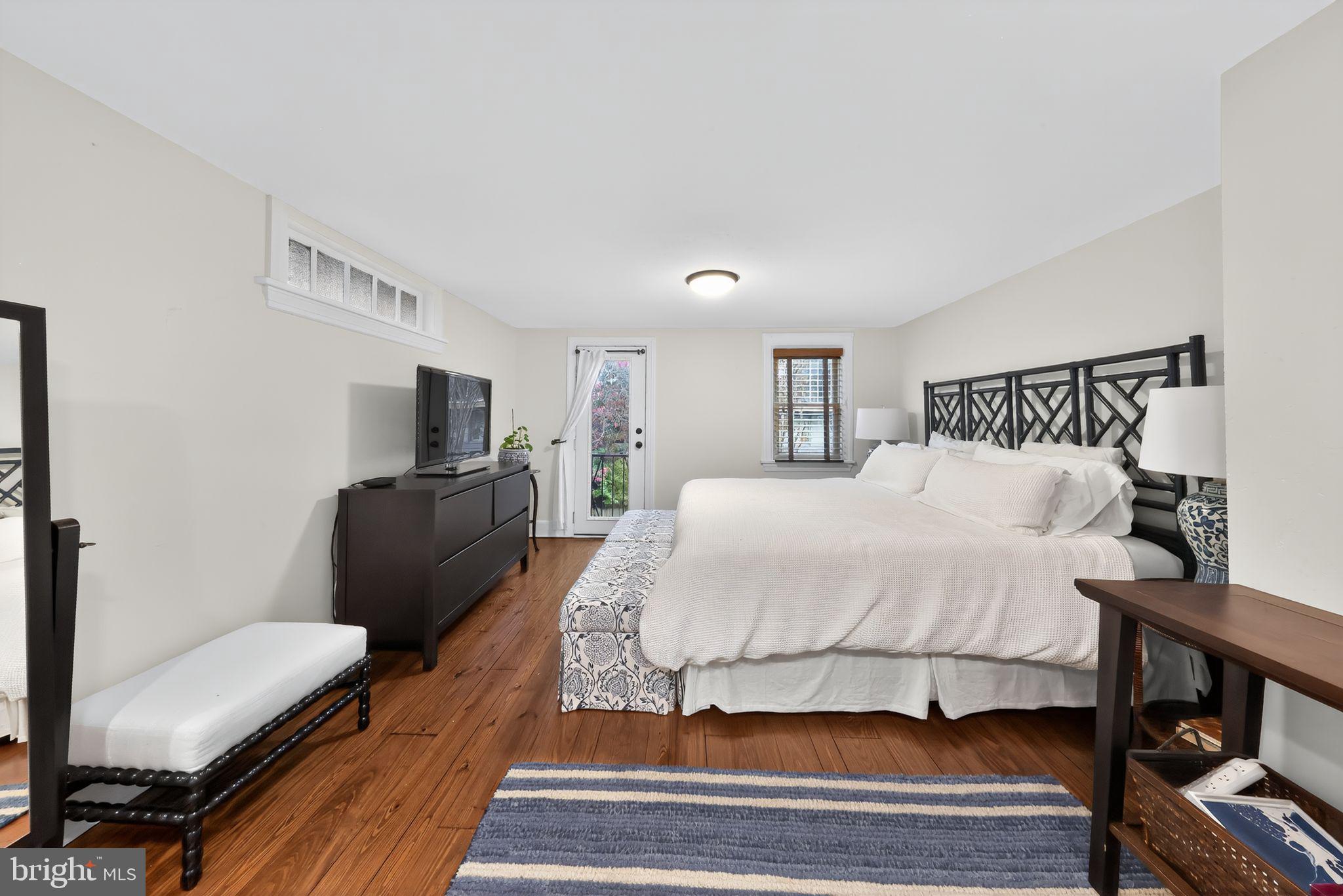 10 Rockford Road Wilmington, DE 19806 - Photo 18 of 30 a spacious bedroom with a bed and wooden floor