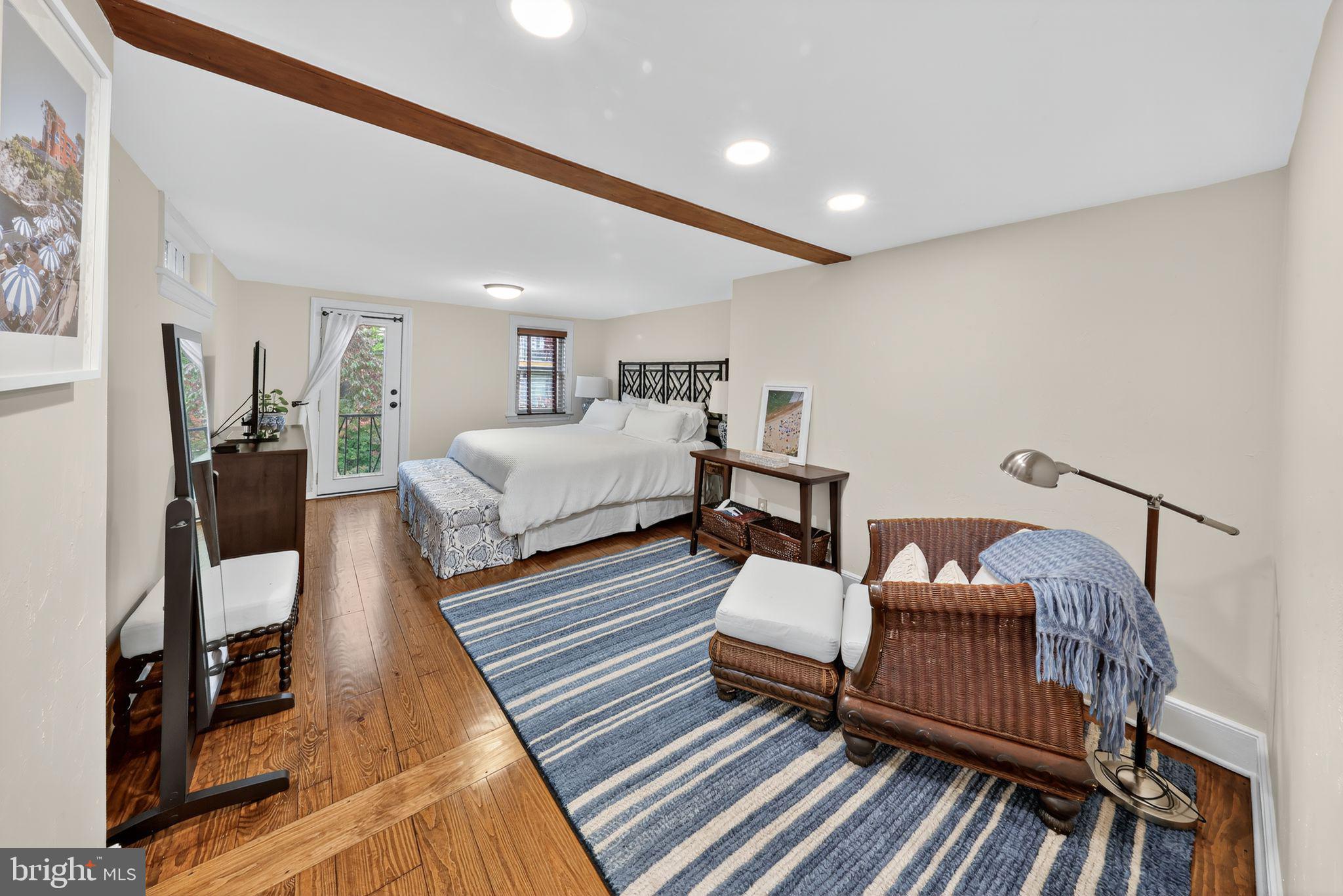 10 Rockford Road Wilmington, DE 19806 - Photo 20 of 30 a spacious bedroom with a bed and wooden floor