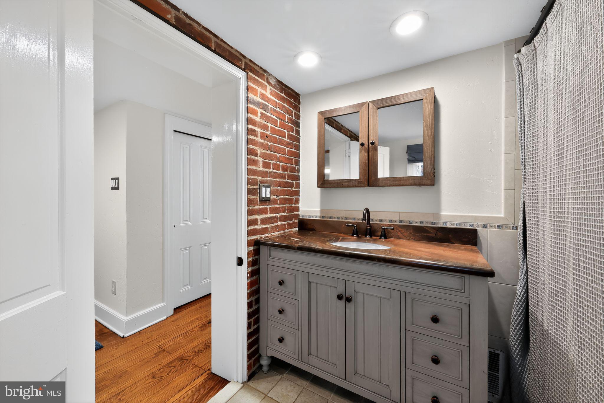 10 Rockford Road Wilmington, DE 19806 - Photo 24 of 30 a bathroom with a sink and a mirror