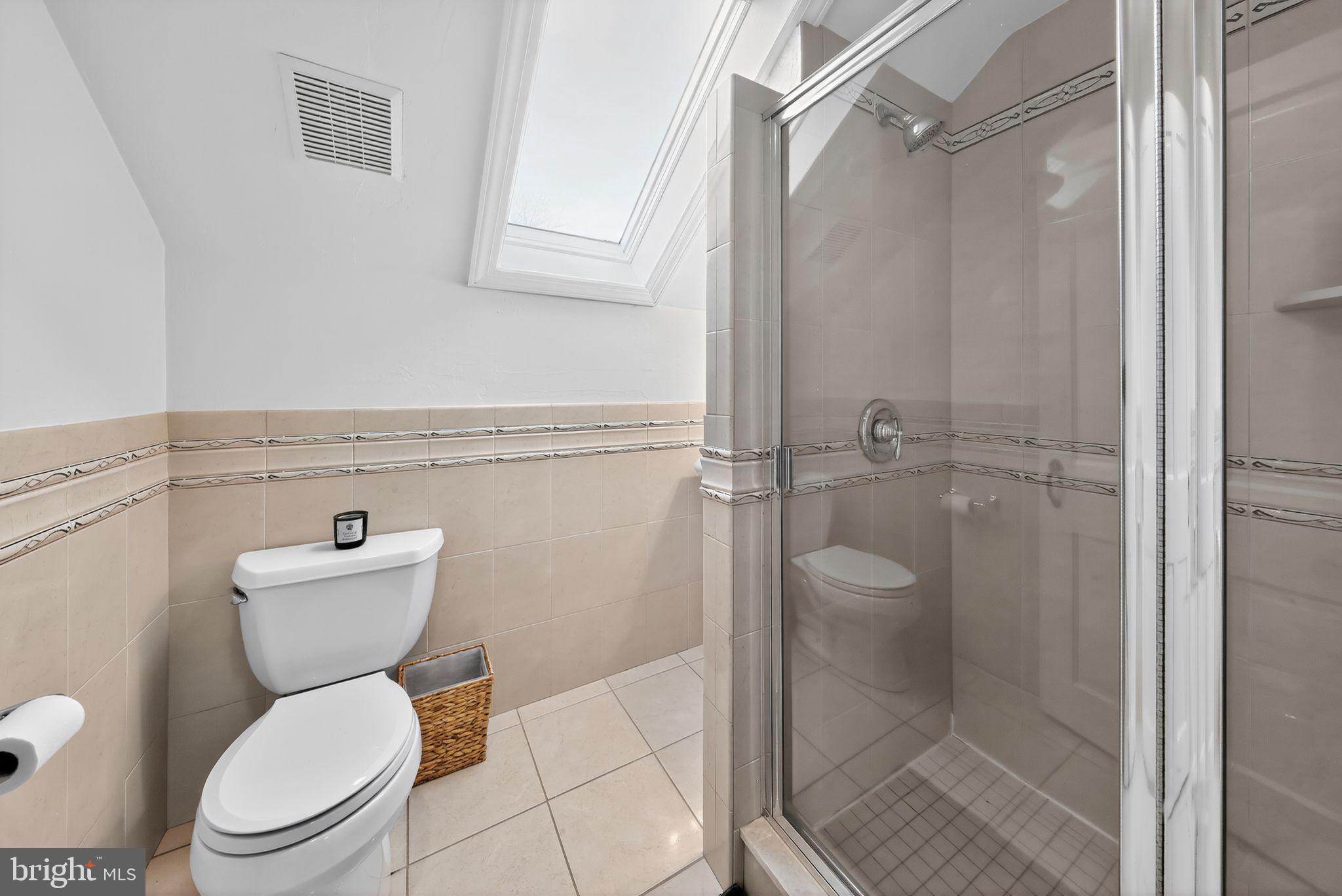 10 Rockford Road Wilmington, DE 19806 - Photo 25 of 30 a bathroom with a toilet a sink and a shower