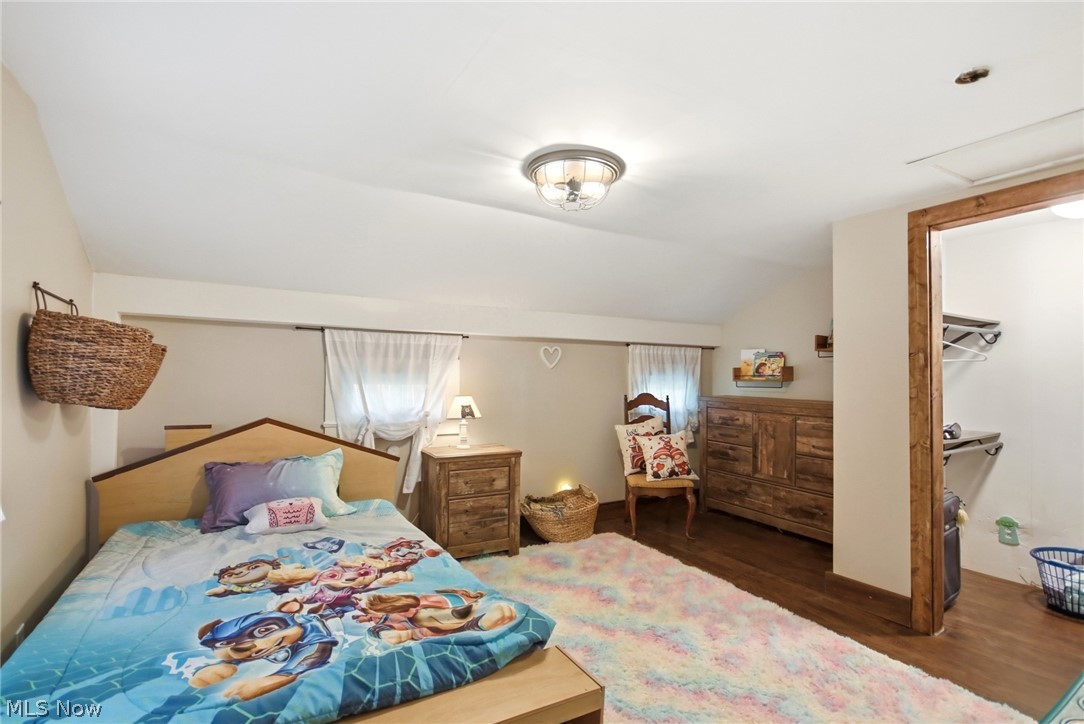 2591 Wayland Road Deerfield, OH 44411 - Photo 22 of 46 Bedroom featuring sloped ceilings and wood-finish flooring