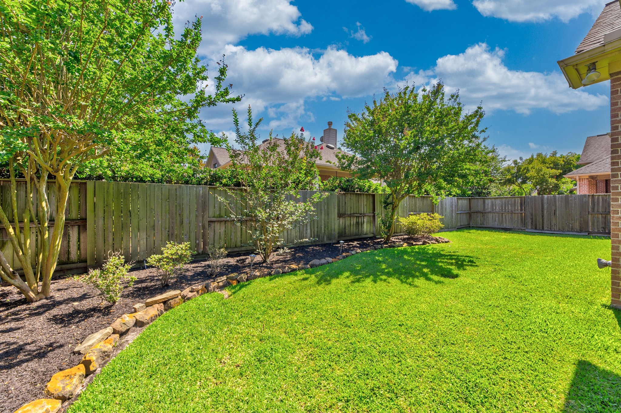 1222 Brinson Court Spring, TX 77379 - Photo 35 of 35 a backyard of a house with lots of green space