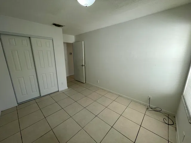 a bathroom with a sink a toilet and shower curtain