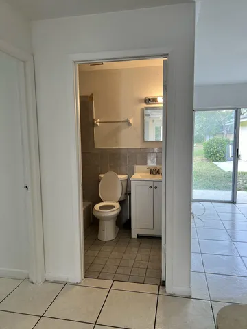 a bathroom with a sink toilet and a shower
