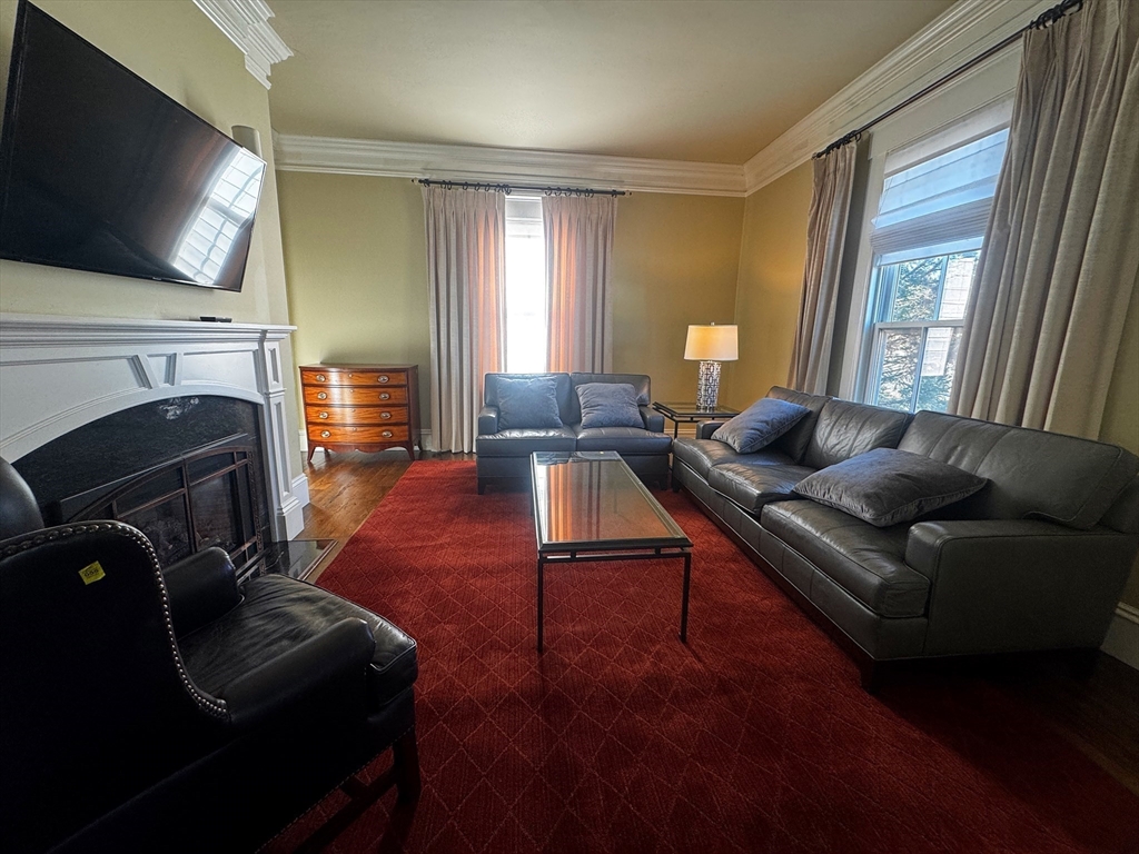 154 Main Street Andover, MA 01810 - Photo 15 of 42 a living room with furniture and a flat screen tv