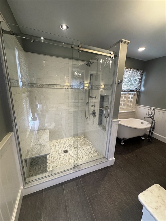 154 Main Street Andover, MA 01810 - Photo 24 of 42 a bathroom with a tub and a mirror