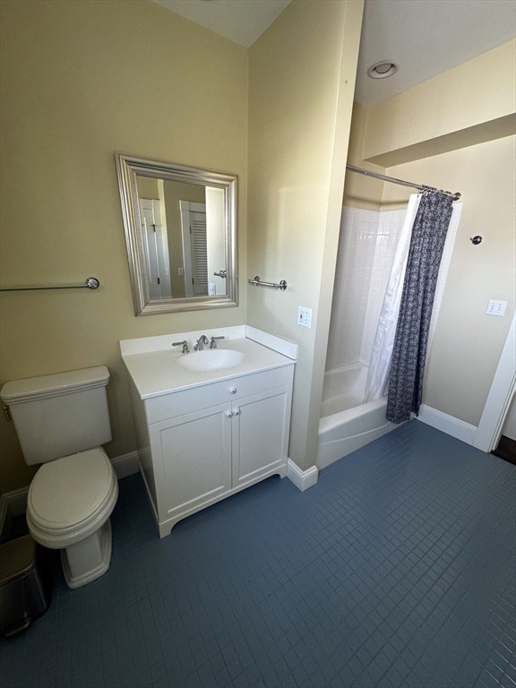 154 Main Street Andover, MA 01810 - Photo 31 of 42 a bathroom with a sink a toilet and a mirror