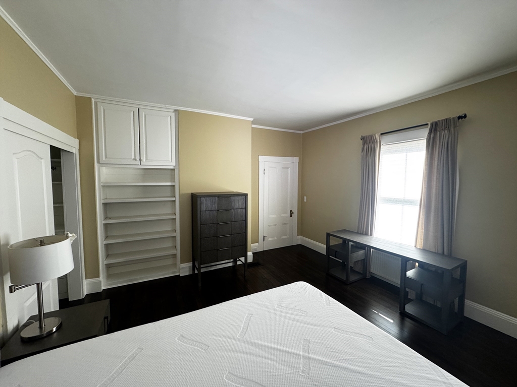 154 Main Street Andover, MA 01810 - Photo 33 of 42 a bedroom with a bed and a dresser