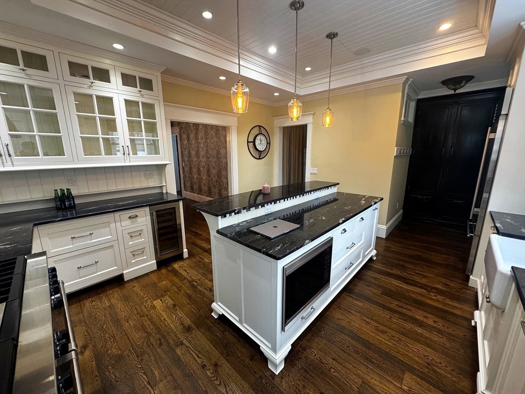 154 Main Street Andover, MA 01810 - Photo 7 of 42 a kitchen with stainless steel appliances granite countertop a stove and a refrigerator
