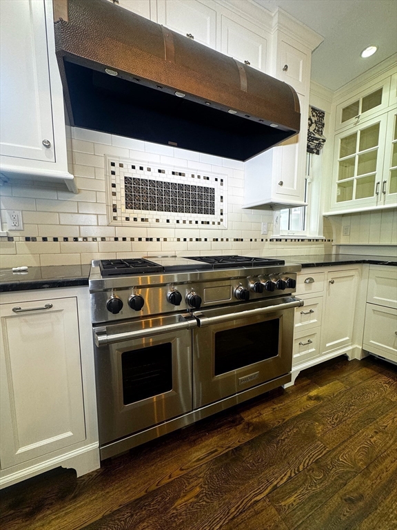 154 Main Street Andover, MA 01810 - Photo 9 of 42 a stove top oven sitting inside of a kitchen