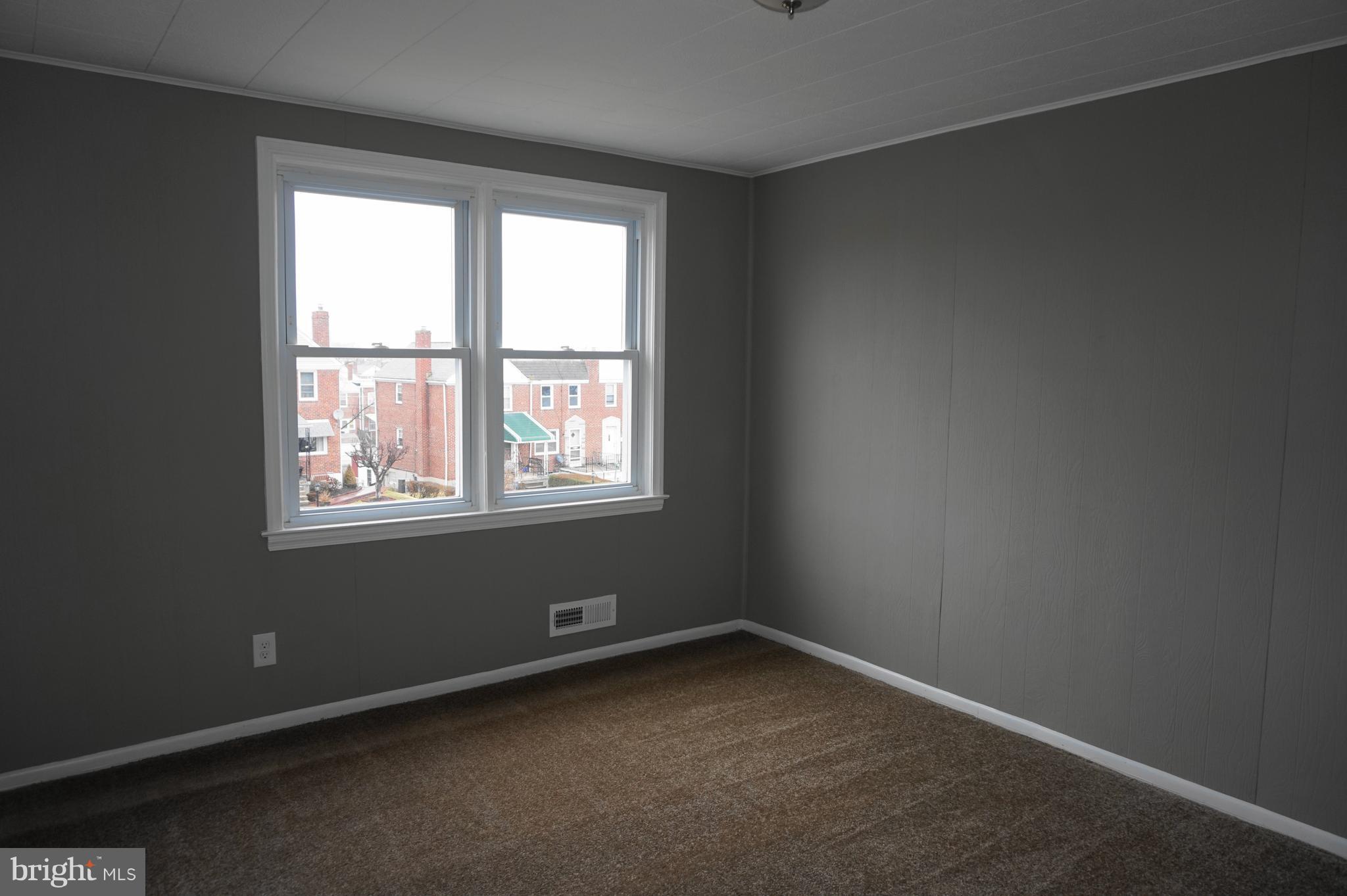 7459 School Avenue Dundalk, MD 21222 - Photo 11 of 23 an empty room with a window