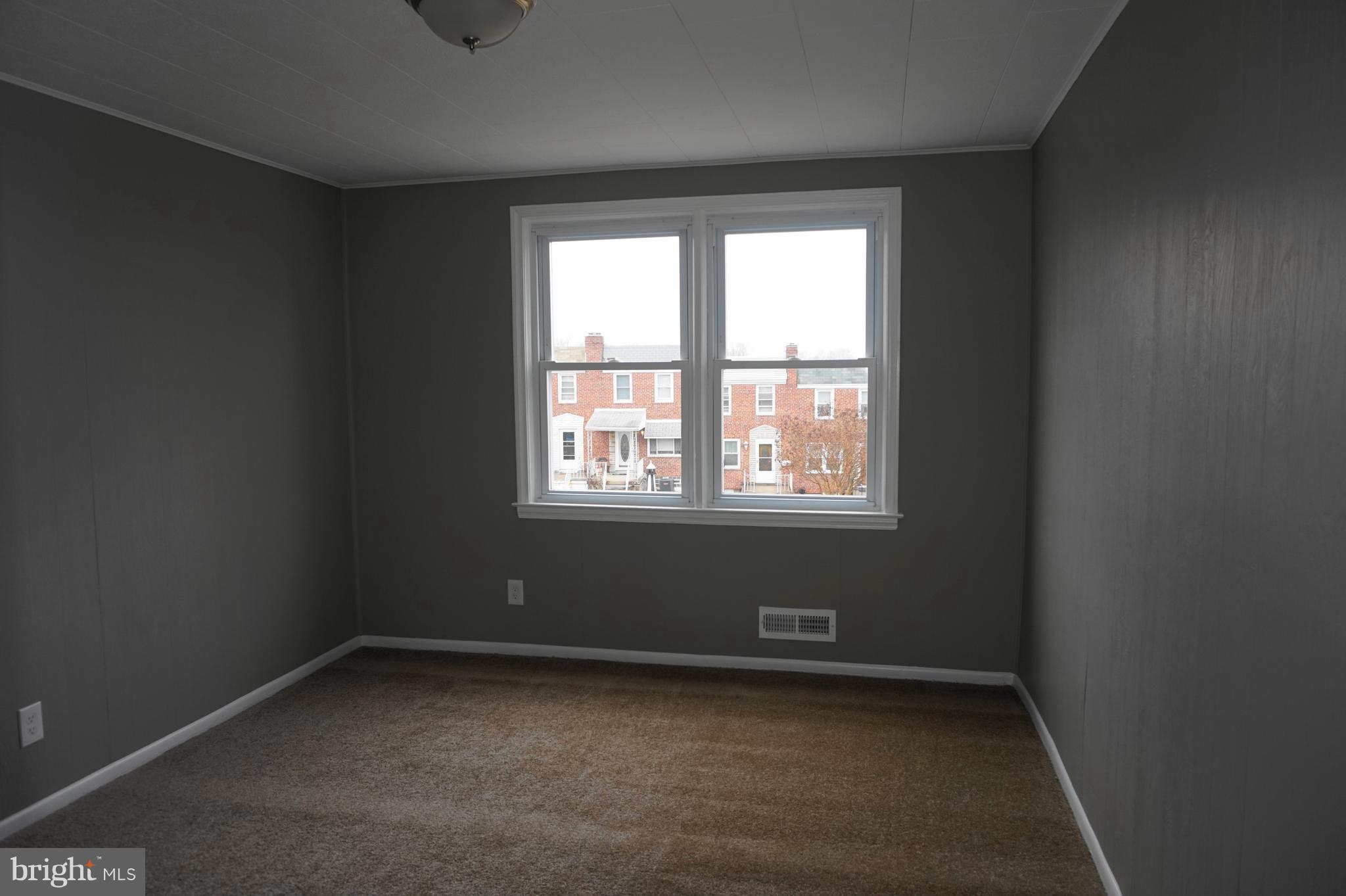7459 School Avenue Dundalk, MD 21222 - Photo 12 of 23 an empty room with a window